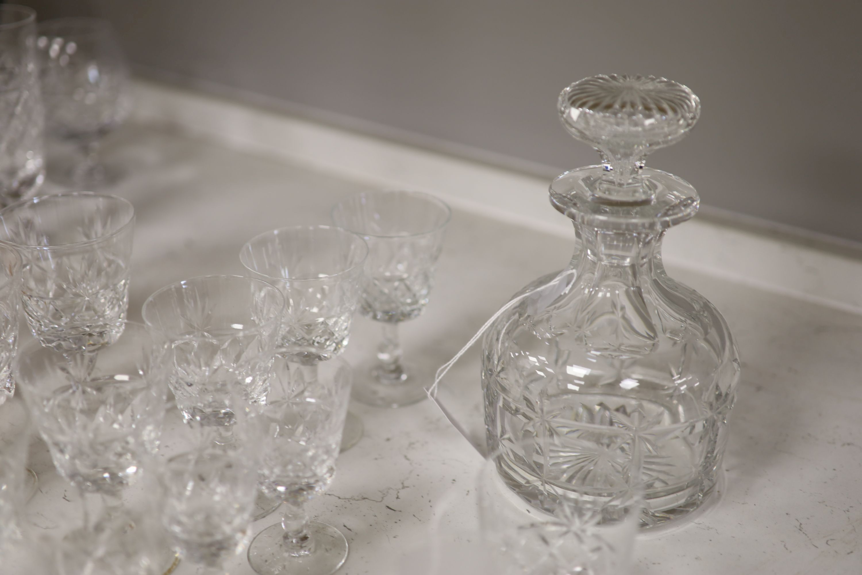 A Brierley cut glass decanter and stopper and a part suite of Brierley 'Bruce' pattern table glass,